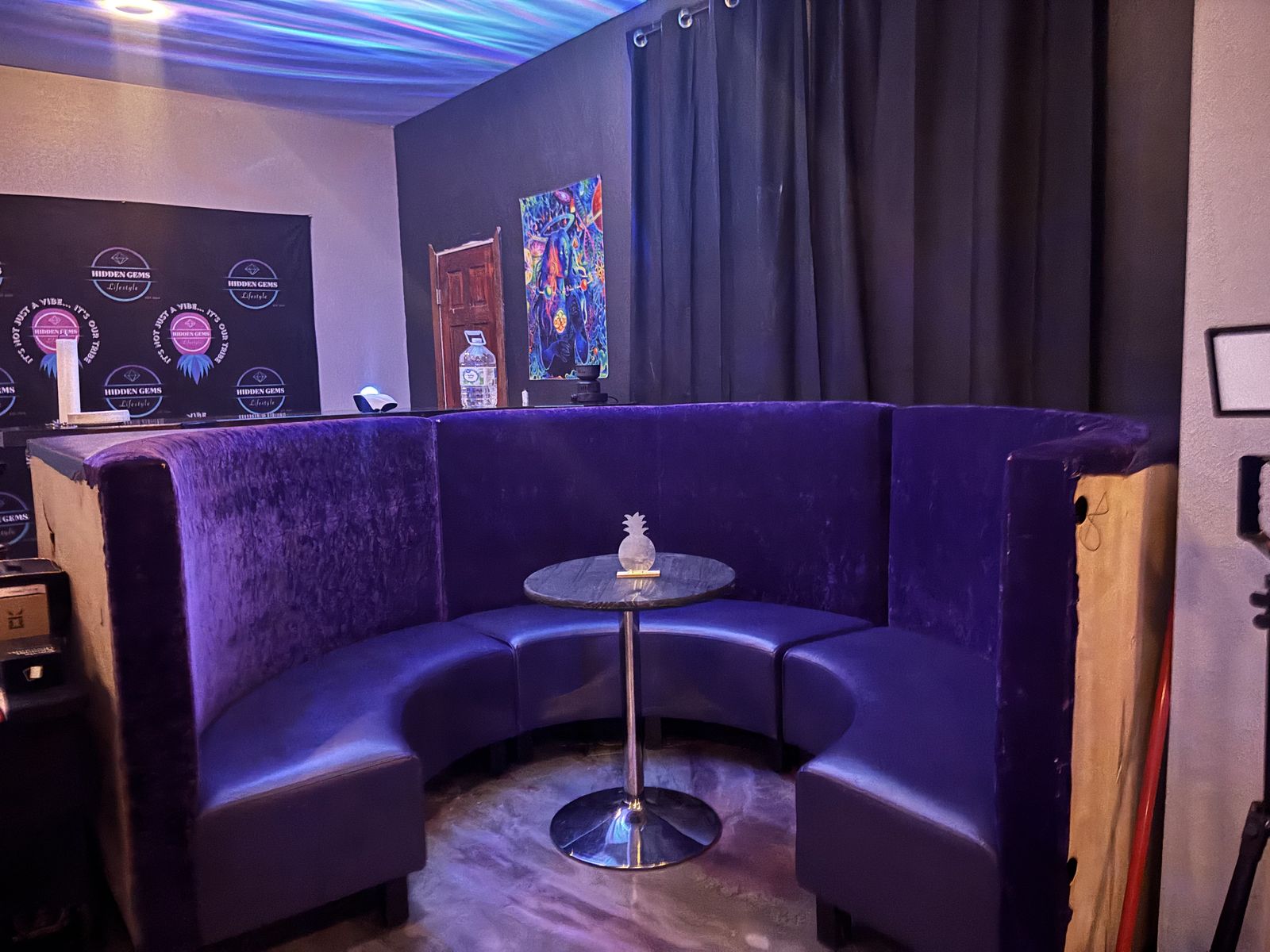 Purple velvet booth in the basement lounge